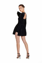 Load image into Gallery viewer, Luxurious black velvet mini dress with an oversized satin bow detail, structured pleated skirt, and a timeless, elegant design—perfect for formal occasions and upscale events.
