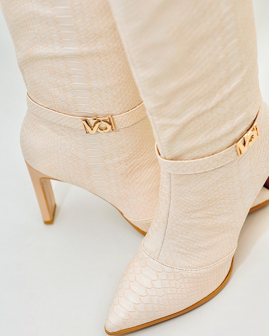 croc effect knee high boots in cream chameleon